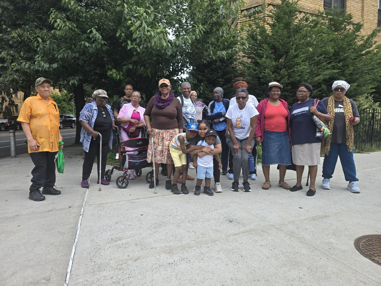 Adults and children gathered together after a community wellness walk